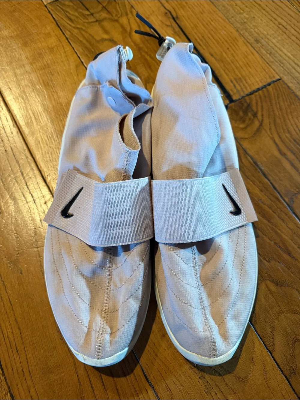 Nike Men’s Slip-On Training Shoes in Pale Pink with Black Swoosh